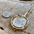 El Cazador Shipwreck - 2 Reales  - Dated 1768  - "Old style pillar design" - Carlos III - Presented in a 14K gold dreamcatcher mount with Diamond, Ruby, and Sapphire accents