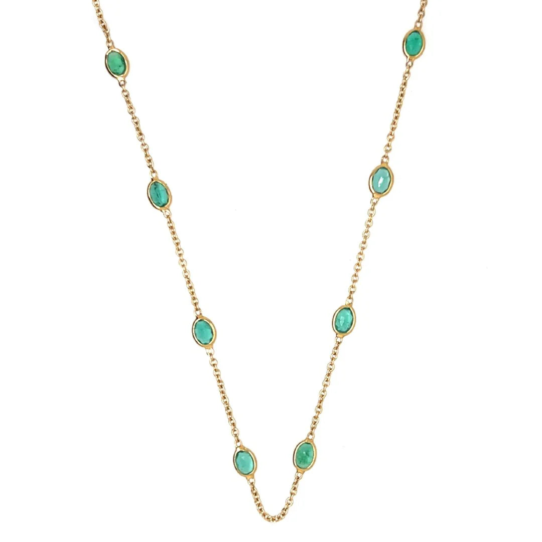Emerald station necklace in 14k yellow gold