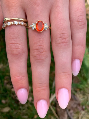 Fire Opal Ring with diamond clusters in 14k gold
