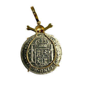El Cazador Shipwreck - 2 Reales - Dated 1776 - Presented in a 14K gold skull and cross bones