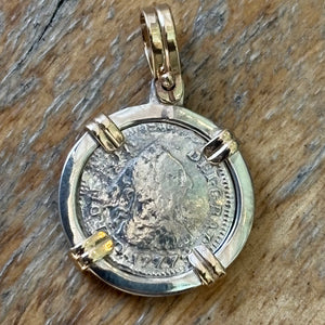 El Cazador Shipwreck - 1/2 Reales - Dated 1777 - Grade Mint - Mounted in a sterling frame with 14K prongs and bale
