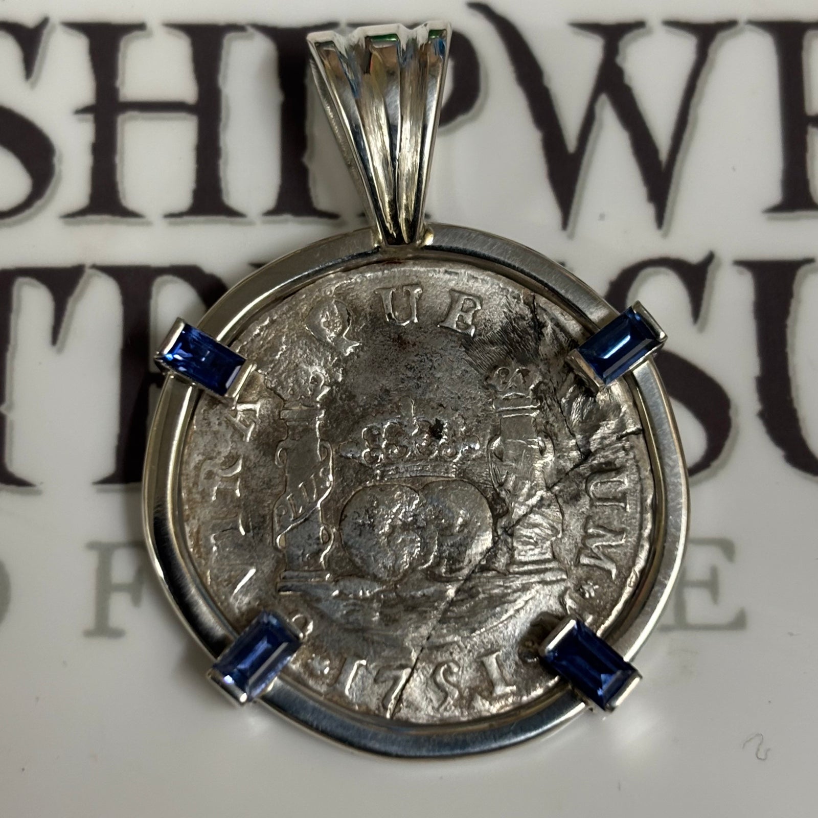 El Cazador Shipwreck - 2 Reales  - Dated 1751 - Mounted in Sterling Silver with blue sapphire accents on prongs