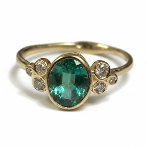 Zambian Emerald in 14K gold ring. Accented with six(6)  Diamonds - Size 7