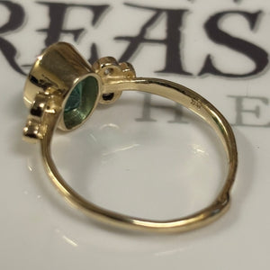 Zambian Emerald in 14K gold ring. Accented with six(6)  Diamonds - Size 7
