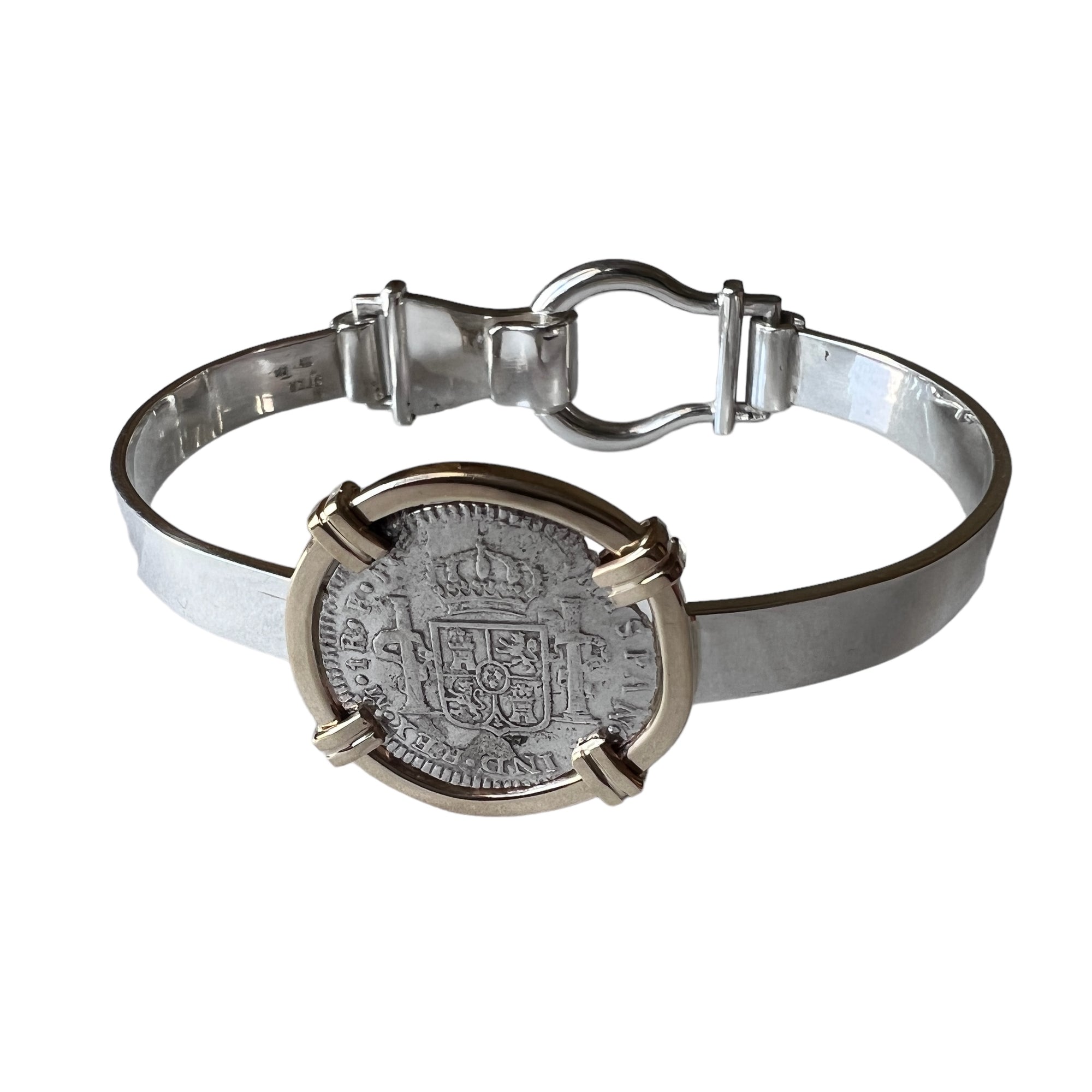 El Cazador Shipwreck - 1 Reales - Reign of Carlos III - Dated 1781 - Presented in a custom Sterling  Silver bracelet with a 14K Gold frame